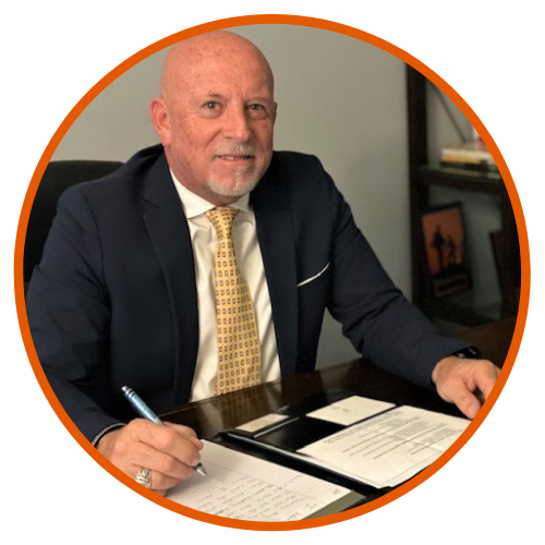 Superintendent Jim Brady, image sitting at his desk